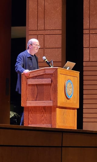 Image of David Grann giving his presentation at the lecture behind a podium