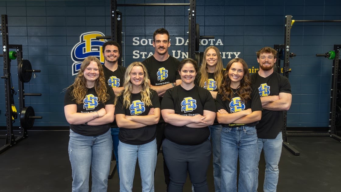 The exercise science researchers of the FRST Center team pose for a picture in front of the new lab space. 