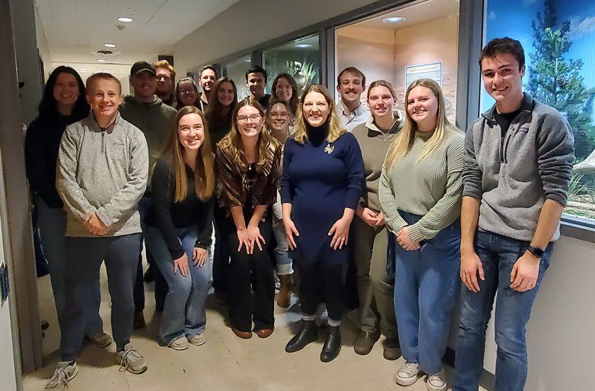 NRM 321 Park Interpretation class students with Dr. Jenn Zavaleta Cheek and the grad assistant Blake Pulse in front of the display cases