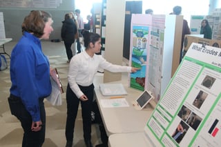 middle school student presenting science project