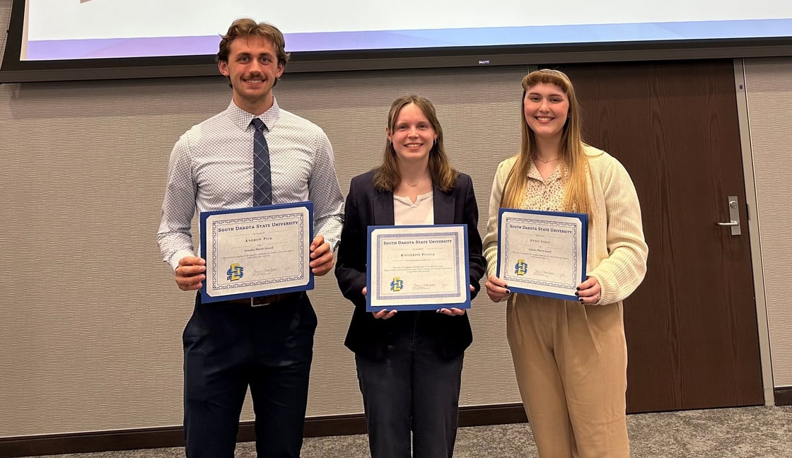 (left to right) Andrew Pick, Katherine Pfeifle, and Annie Feden pose together holding their award certificate.