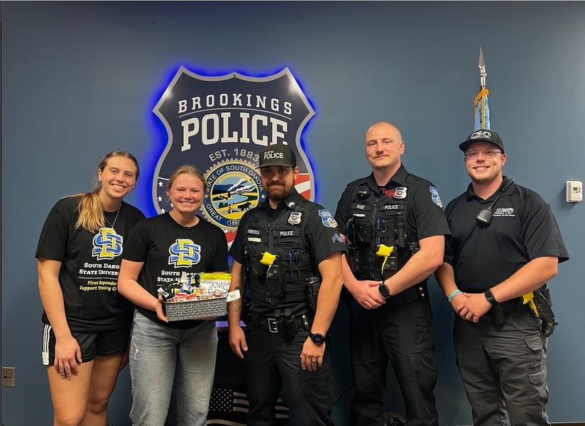 FRST Center members smile with Brookings Police Department